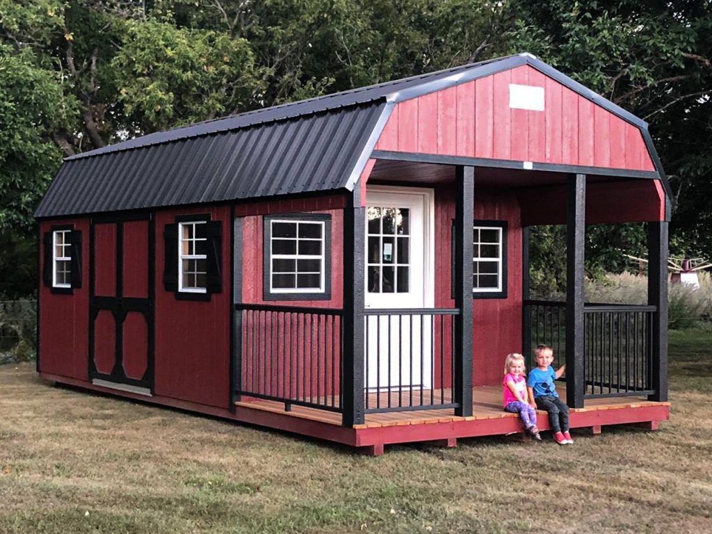 High barn shed with a porch used as a portable cabin in ia