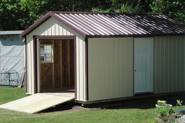 Metal garage for lawn and garden tool shed