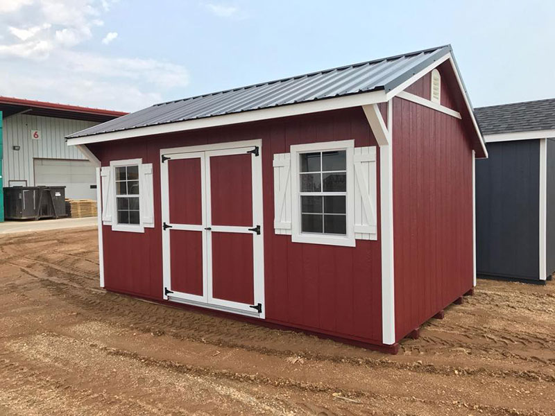 Quaker shed with wood panel siding